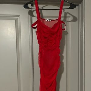 Bodycon, sheer red dress.